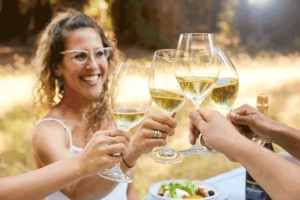 woman cheering white wine